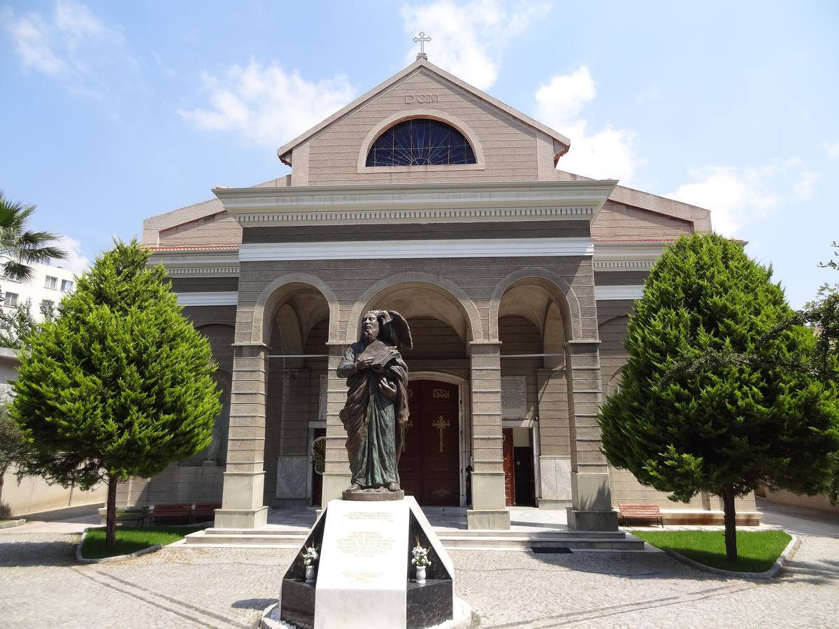 The Catholic cathedral of St. John in İzmir, with a statue of the apostle holding his Gospel, his eagle at his shoulder, in front of the portico