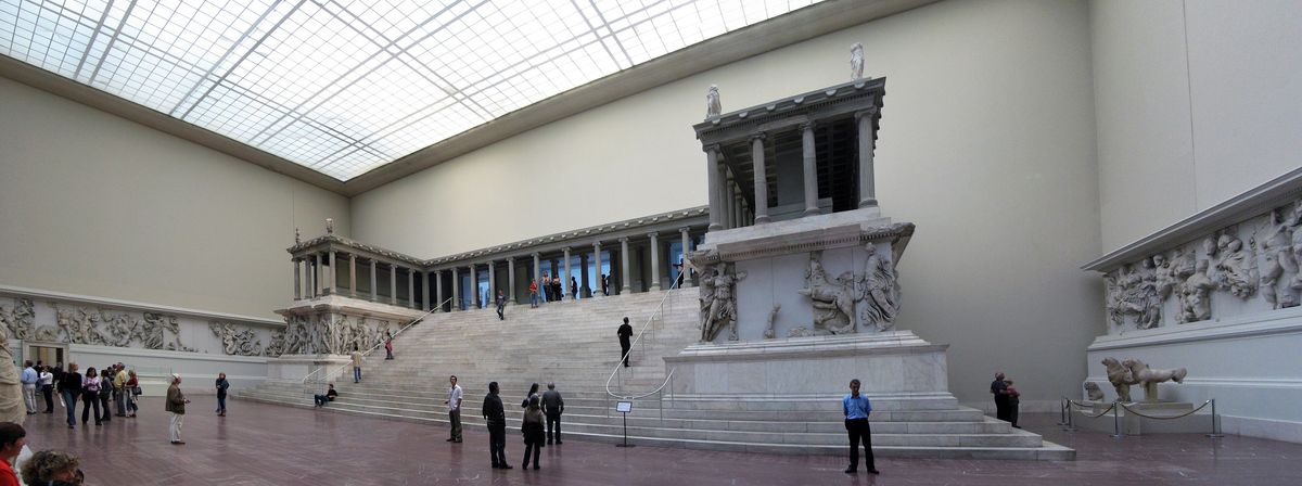 The rebuilt west front of the Pergamon Altar inside the Pergamon Museum in Berlin, with more of the giant frieze mounted on the hall walls