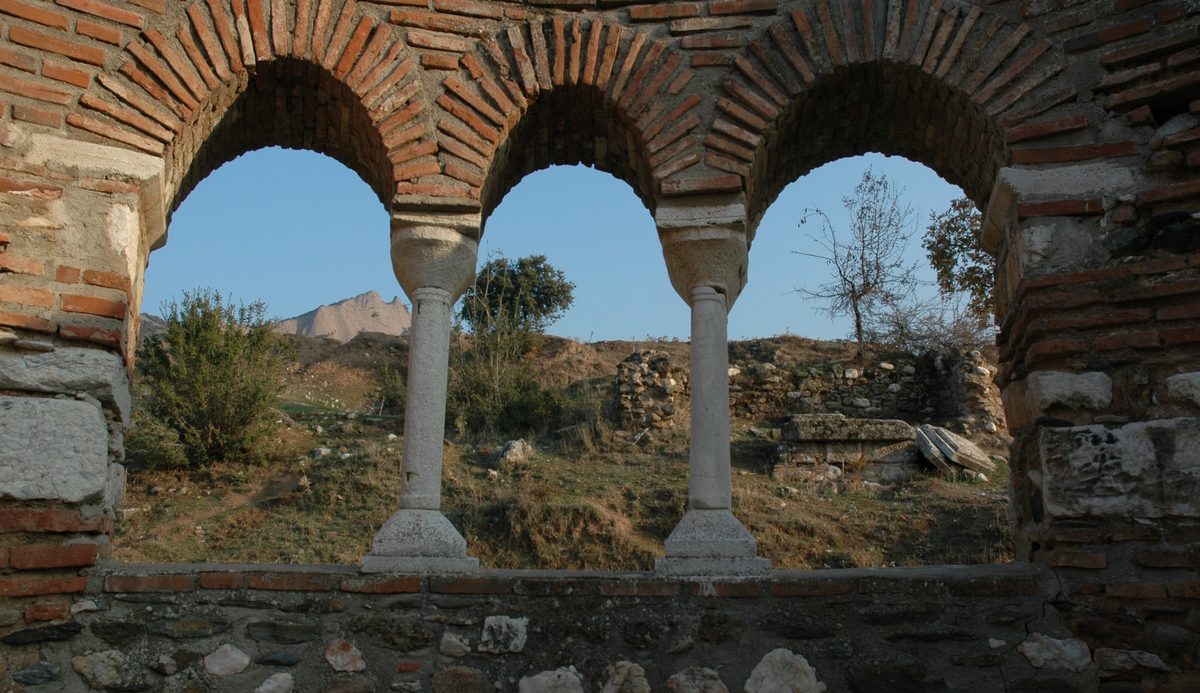 The small brick church at the corner of the Temple of Artemis at Sardis, with the temple's columns behind